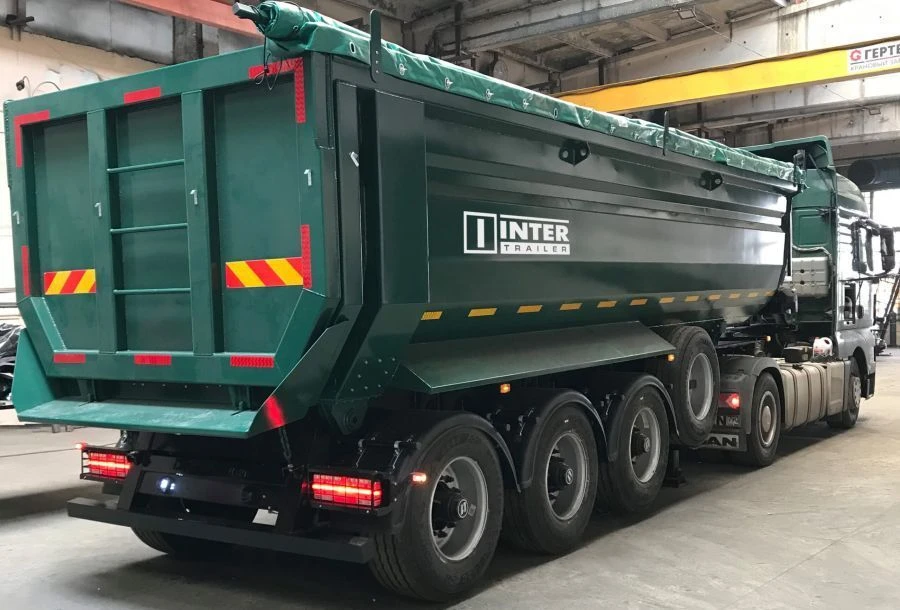 Tipper-trailer with rear dump body type 85333, modification 853332. Metal tipper body of semi-circular cross-section with tippin