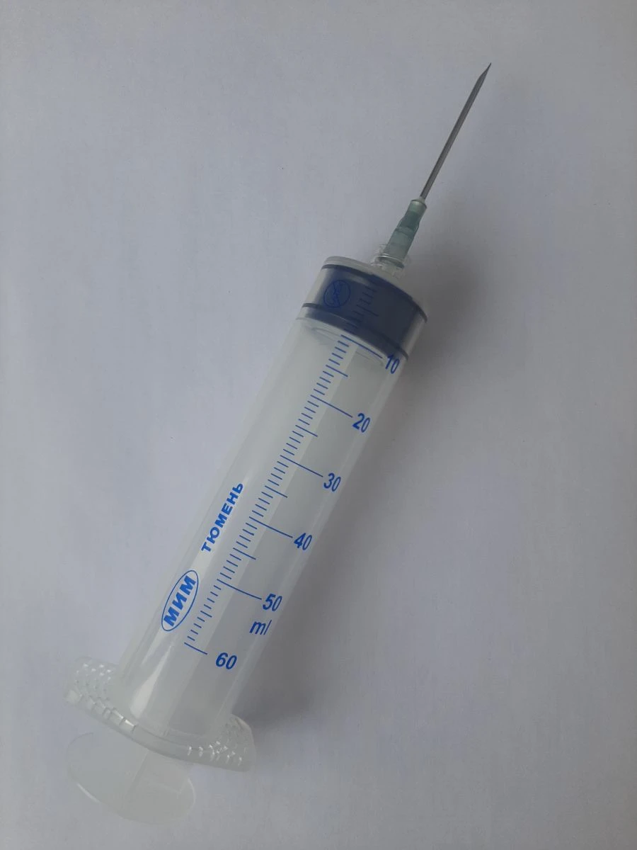 Single-use syringe, three-detail, with Luer-lock tip, nominal capacity 50 ml with 1.8x injection needle