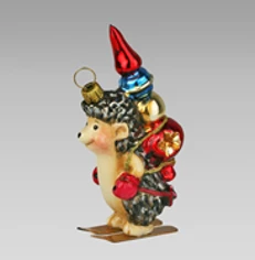 Handmade glass Christmas tree toy "A hedgehog on skis with a macushka"
