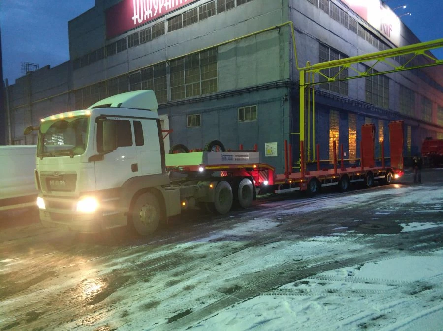 Semi-trailer heavy hauler Politrans 94184-073. In design: metal sliding platform with straight load platform, with flatbed