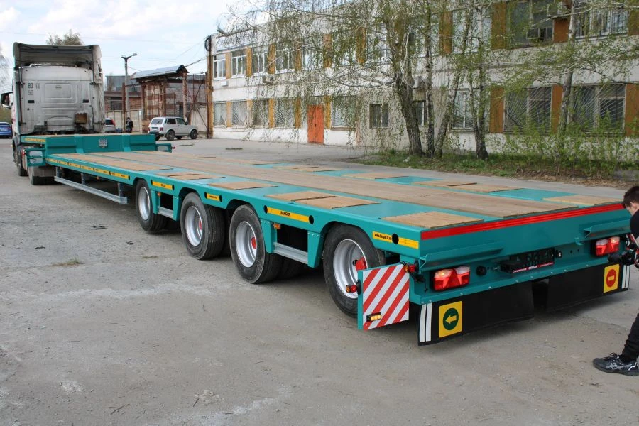 Semitrailer 9854 in modification 9854-0000060-07 variant with metal platform with mechanical ladders, with cones, with pneumatic
