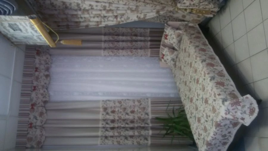 Curtains (including drapes) and inner curtains; lambrequins and bedspreads of cotton yarn.
