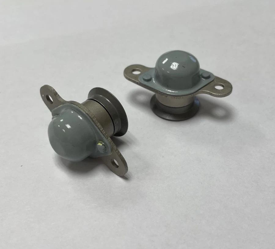Body with cap of a small-size power lock with a sleeve flanged for locking hatches of aeroplanes and helicopters.