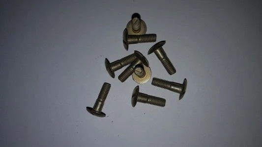 Bolts with flat-rounded head with technological shank made of titanium alloy for connections with tension OST 1 31066-86