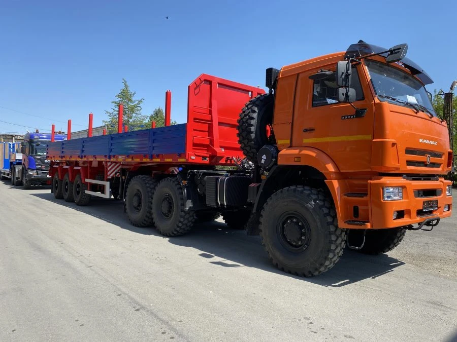Semitrailer Politrans 94171-0000011. In the version: metal platform with decking, with pneumatic suspension. Axles manufactured