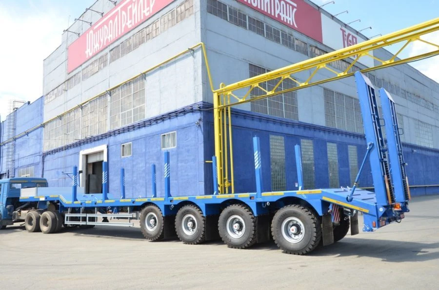 Semitrailer-heavy hauler Politrans 94184-083. In the version of metal sliding platform with a loading platform, with ladders, wi