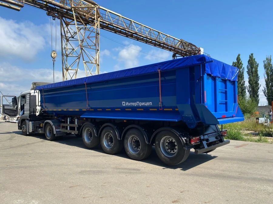 Tipper-trailer with rear dump body type 85337, modification 853372. Metal tipper body of semi-circular cross-section with tippin