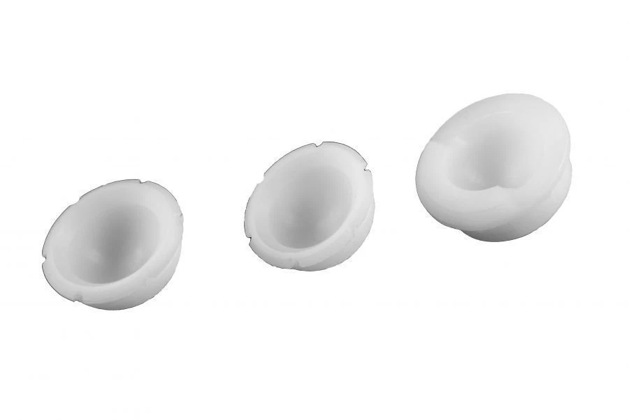 Non-motion-restrictive polyethylene pad for acetabular component of hip prosthesis