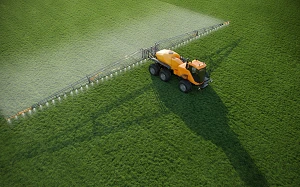 Self-propelled sprayer-spreader TUMAN-3, complete with replaceable technological equipment (boom sprayer T