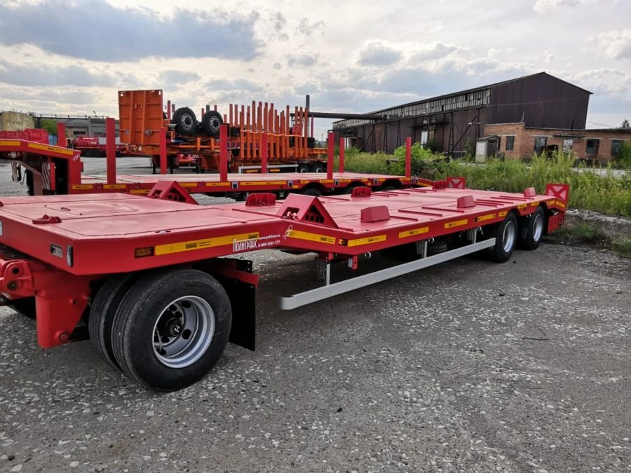 Heavy haulage trailer Politrans 84286-010. In design: metal platform with a loading platform, with a flatbed in the front of the