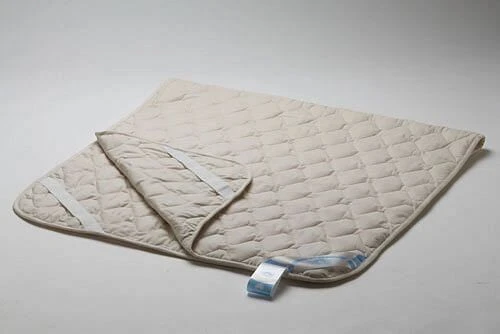 Bedding for children: quilted mattress covers with fillings made of synthetic volumetric fibre.
