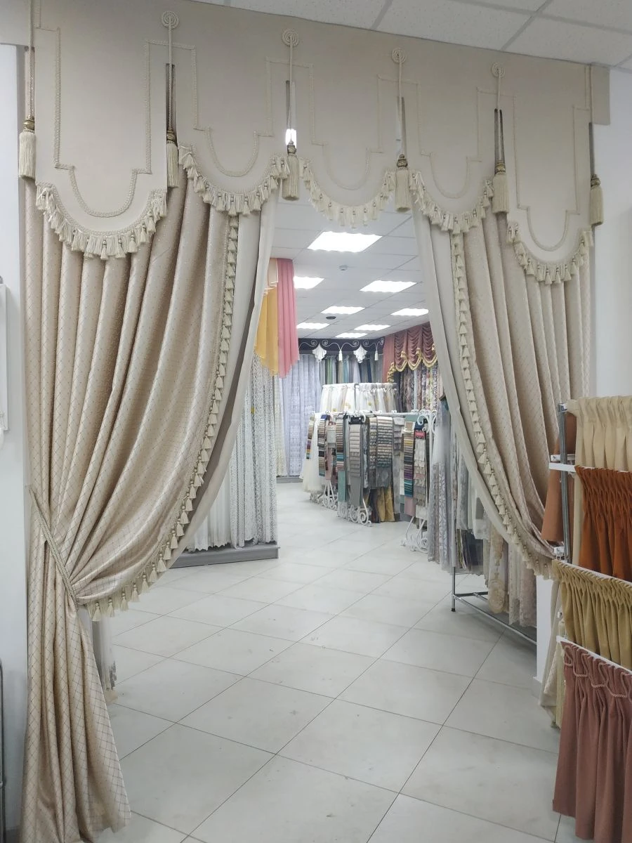 Curtains (including drapes) and inner curtains; lambrequins and bed liners of textile materials.