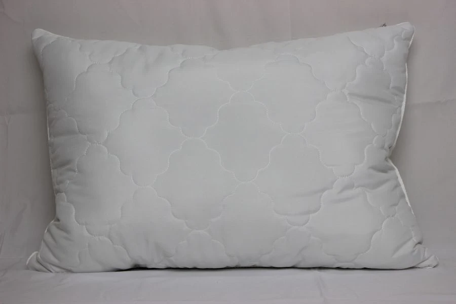 Quilted pillows with top made of natural, mixed, synthetic fabrics with filling made of natural, mixed, synthetic fabrics