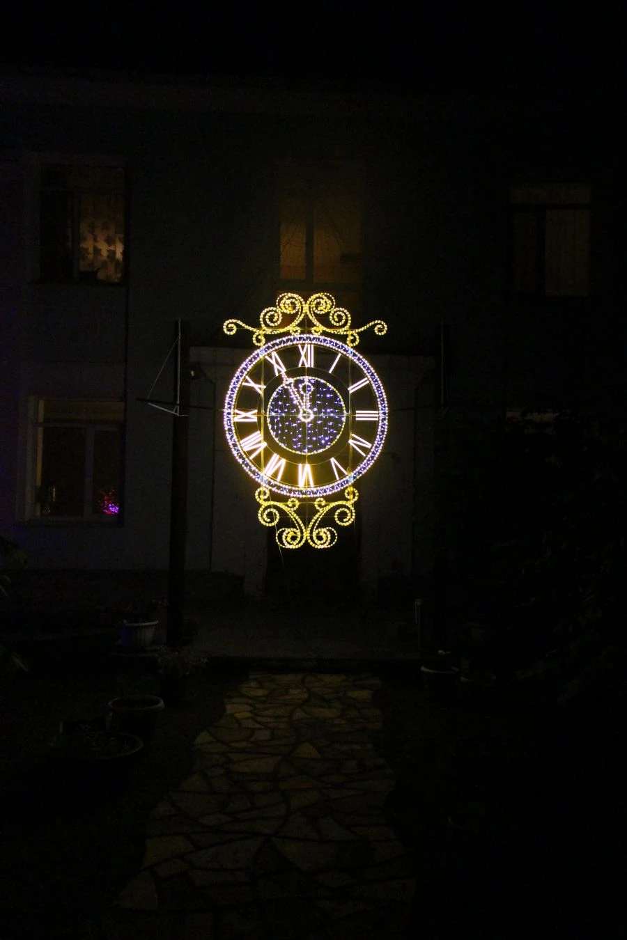 Illumination frame "Clock" - decorative street lamp, installed as an independent stationary object.