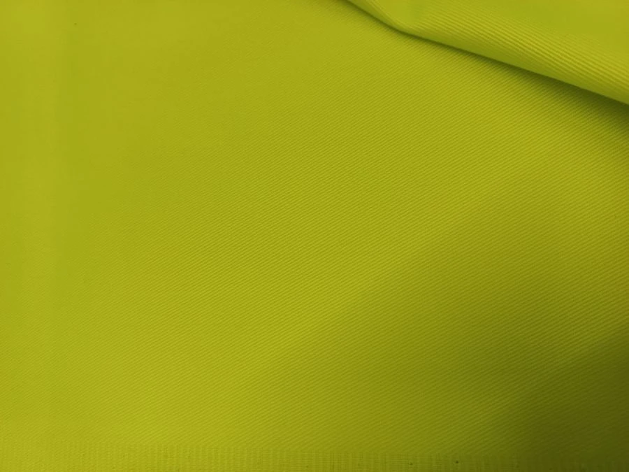 Ready-made smooth-dyed polyester-cotton fabric, fluorescent yellow colour, for the manufacture of special signal clothing