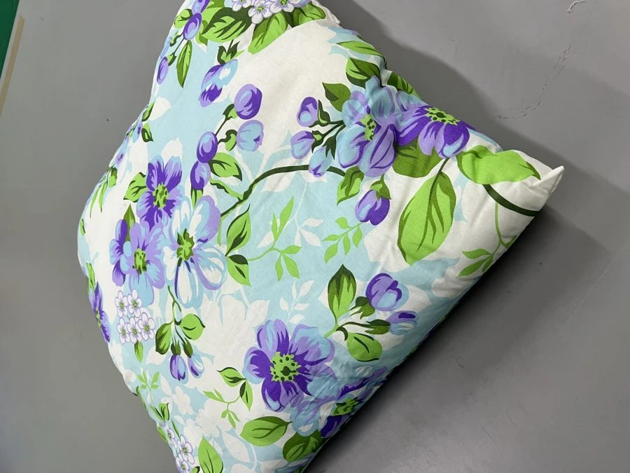 Pillow made of cotton fabrics filled with artificial swan fluff.