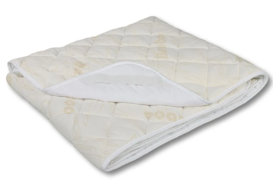 Quilted mattress pads made of cotton, mixed synthetic fabrics with fibre fillings
