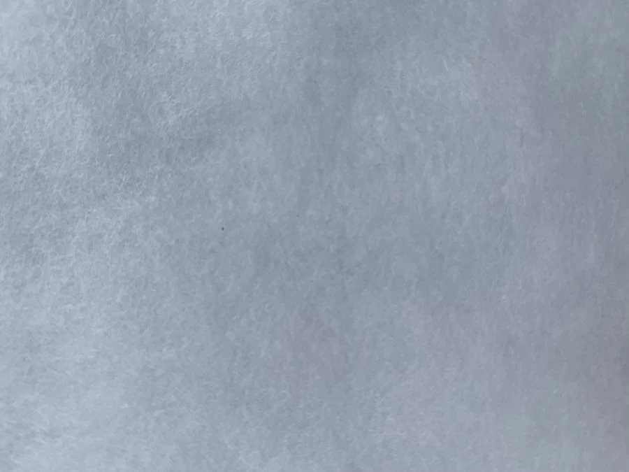 Nonwoven thermally cross-linked bulk nonwoven fabric of Shelter® LUX grade with a surface density of less than 150 g/m2