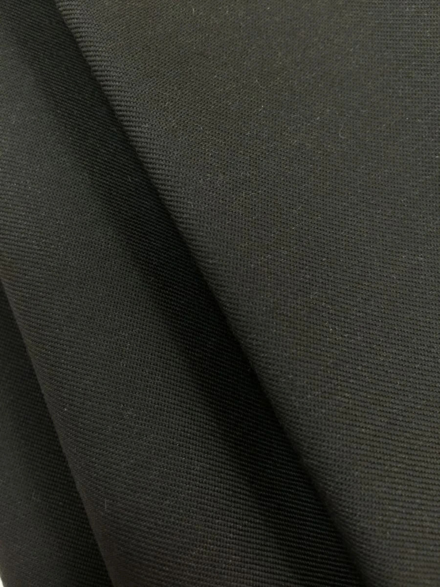 Heat-resistant fabric made of synthetic fibre yarns with flame-retardant, anti-electrostatic and oil and water-repellent propert
