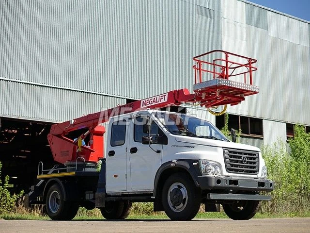 Self-propelled boom lift with working platform PSS-131.18E with all-metal box section boom on chassis base