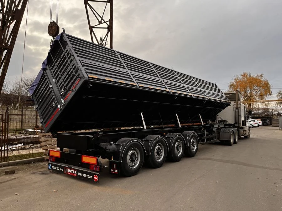 Tipper semi-trailer with side dump body type 85339, modification 853393. Metal tipper body of square cross-section with tipping.