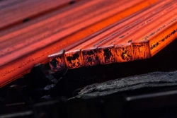 Cast square billet of non-alloy steel containing less than 0,25 wt.% carbon. Side not exceeding 130 mm