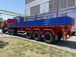 Semitrailer Politrans 94171-0000010. In the version: metal platform with decking, with sides, with stands (cones) on spring susp