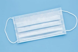 Disposable three-layer non-sterile medical mask with elastic band.