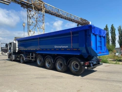 Tipper semi-trailer with rear dump body type 85339, modification 853392. Metal tipper body of semi-circular cross-section with t