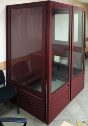 Metal cabin for the defendant in the courtroom. Court furniture