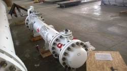 Heat exchanger for heating regenerated MEA solution