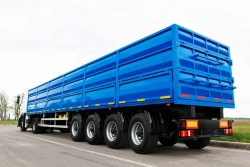 Semitrailer grain carrier type 85338, modification 853381. Metal flatbed platform with front fixed side, rear and side walls, wi