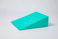 Wedge-shaped cushion made of multilayer barrier fabric with polyurethane and/or polyvinylchloride coating, inner filling n