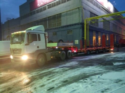 Semi-trailer heavy hauler Politrans 94184-073. In design: metal sliding platform with straight load platform, with flatbed