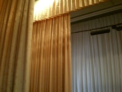 Curtains (flat parts of theatre scenery, placed on the sides of the stage).