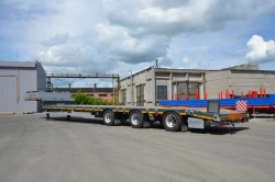 Semi-trailer heavy hauler Politrans 94183 -030. In version: metal platform with a straight load platform, with a flatbed platfor