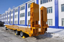 Heavy haulage trailer Politrans 84286-010. In the version: metal platform with a loading platform, with ladders, with flatbed