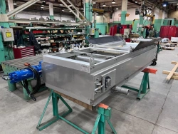 Mechanised rake sewer grating