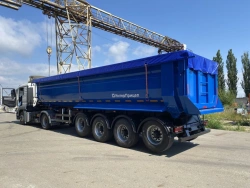 Tipper-trailer with rear dump body type 85334, modification 853342. Metal tipper body of semi-circular cross-section with tippin