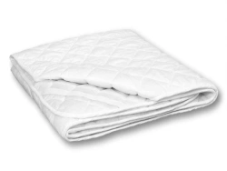 Bedding accessories: quilted mattress covers with fibre fillings