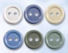 Glass-filled polyamide button with two holes, diameter 11 mm, assorted colours