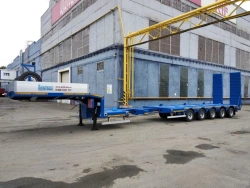 Semitrailer-heavy hauler Politrans 94185-060. In the version of metal sliding platform with a loading platform, with ladders, wi