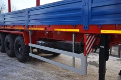 Semitrailer Politrans 94171-026. Wheel axle "Plant" 1201-2410002. Tyre 385/65R22.5, 14.00R20. In version: metal platform