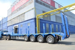 Semitrailer-heavy hauler Politrans 94184-083. In the version of metal sliding platform with a loading platform, with ladders, wi