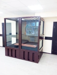 Metal cabin for the defendant in the courtroom. Court furniture