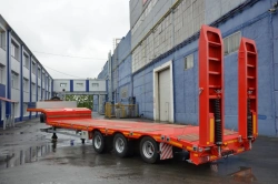 Semitrailer-heavy hauler Politrans 94183 -030. In design: metal platform with a loading platform, with ladders, with flatbed