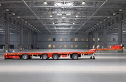 Semitrailer Tverstroimash 993941 modification 0022 straight platform sliding lengthwise with independent steering control