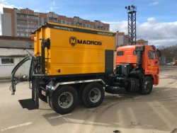 Patching machine (pneumatic spraying method) Madpatcher mounted on chassis/in the body of a dump truck.