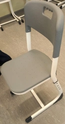 Pupil's chair on metal frame with plastic seat of "Edelwood" trademark