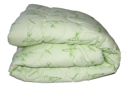 Blanket for adults with a top made of mixed fabrics with synthetic filling.